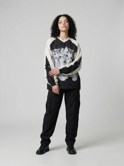 DAXUEN Black oversized pullover with kitten graphic and studs — model photo