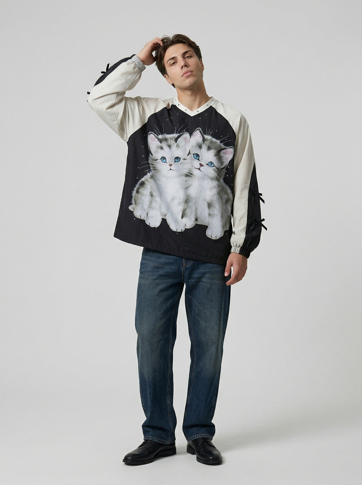 DAXUEN Black oversized pullover with kitten graphic and studs — model photo