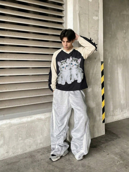 DAXUEN Black oversized pullover with kitten graphic and studs — model photo