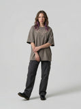 DAXUEN Oversized short-sleeved t-shirt with script graphic — model photo