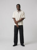 DAXUEN Layered collar loose-fit polo shirt — model photo