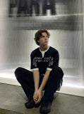DAXUEN Layered distressed graphic t-shirt with text prints — model photo