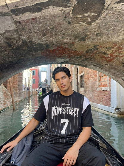 DAXUEN Layered distressed graphic t-shirt with tank top — model photo