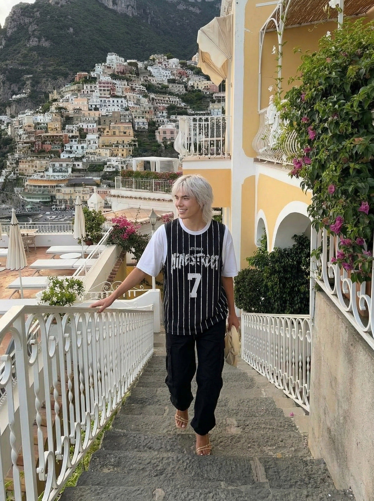 DAXUEN Layered distressed graphic t-shirt with tank top — model photo