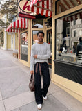 DAXUEN black layered-edge knit long sleeve top — model photo