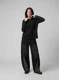 DAXUEN black layered-edge knit long sleeve top — model photo