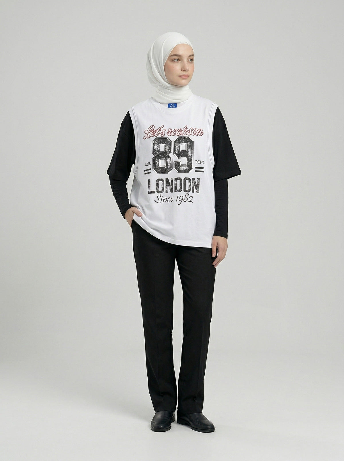 DAXUEN Layered graphic t-shirt and sleeveless vest combo — model photo