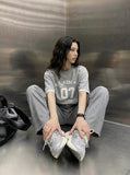 DAXUEN Heather grey short-sleeved graphic t-shirt — model photo