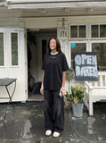 DAXUEN Oversized short-sleeved T-shirt with layered neckline design — model photo