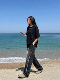 DAXUEN Oversized short-sleeved T-shirt with layered neckline design — model photo
