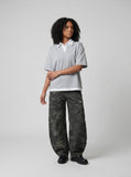 DAXUEN Short-sleeved relaxed-fit polo shirt with faux layered design — model photo