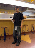 DAXUEN Layered oversized short-sleeve T-shirt with plaid detail — model photo