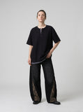 DAXUEN Layered oversized short-sleeve T-shirt with plaid detail — model photo