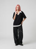 DAXUEN Layered oversized V-neck top with contrasting collar — model photo