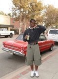 DAXUEN Layered wide-leg cargo shorts in olive-grey — model photo