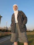DAXUEN Layered wide-leg cargo shorts in olive-grey — model photo
