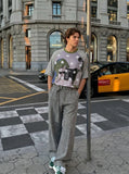 DAXUEN Oversized short-sleeved T-shirt with cat graphic — model photo