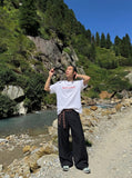 DAXUEN Oversized Geometric Logo Tee — model photo