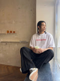DAXUEN Oversized Geometric Logo Tee — model photo