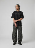DAXUEN Oversized Geometric Logo Tee — model photo