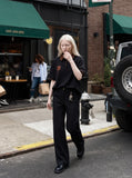 DAXUEN black oversized leopard print collar polo shirt — model photo