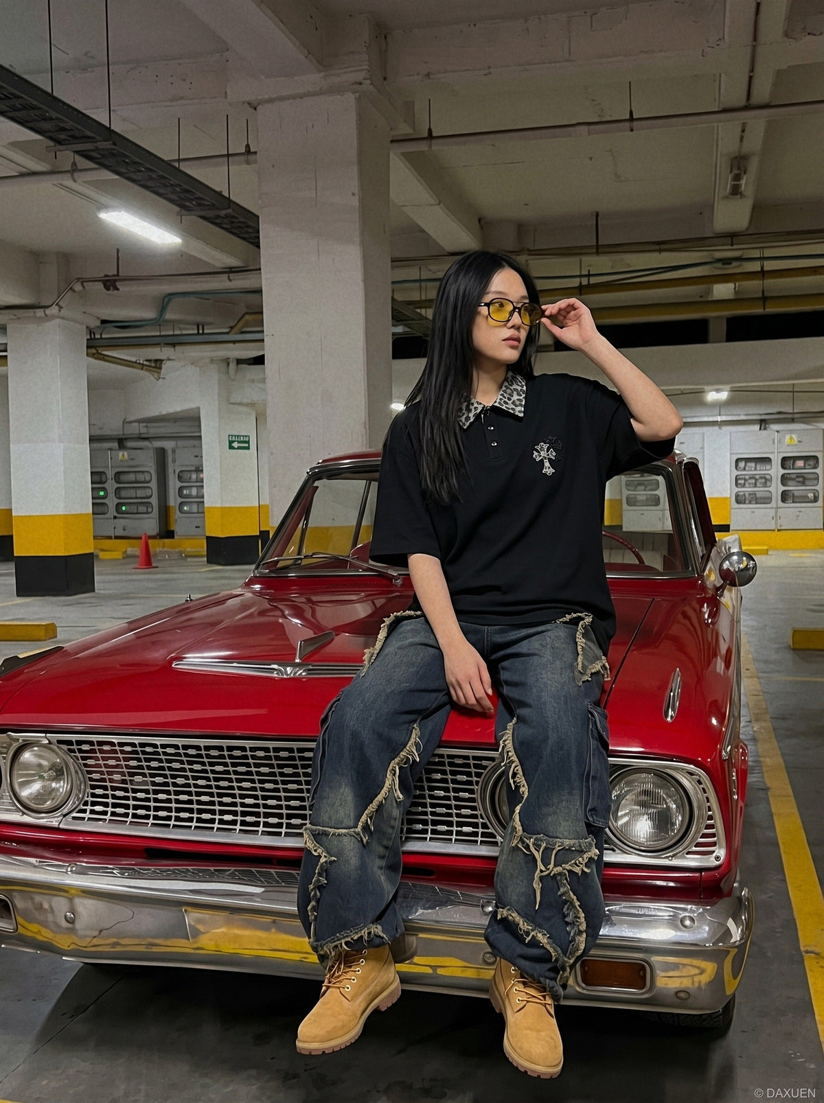 DAXUEN black polo shirt with leopard print collar and cross graphic — model photo