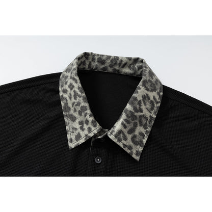 DAXUEN black polo shirt with leopard print collar and cross graphic