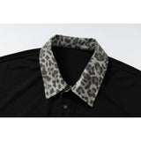 DAXUEN black polo shirt with leopard print collar and cross graphic