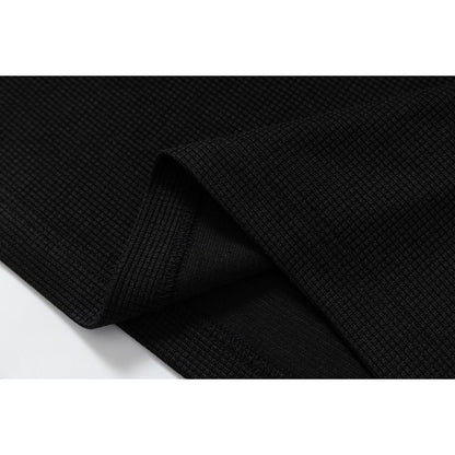 DAXUEN black polo shirt with leopard print collar and cross graphic