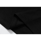 DAXUEN black polo shirt with leopard print collar and cross graphic