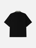 DAXUEN black polo shirt with leopard print collar and cross graphic