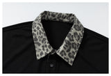 DAXUEN black polo shirt with leopard print collar and cross graphic