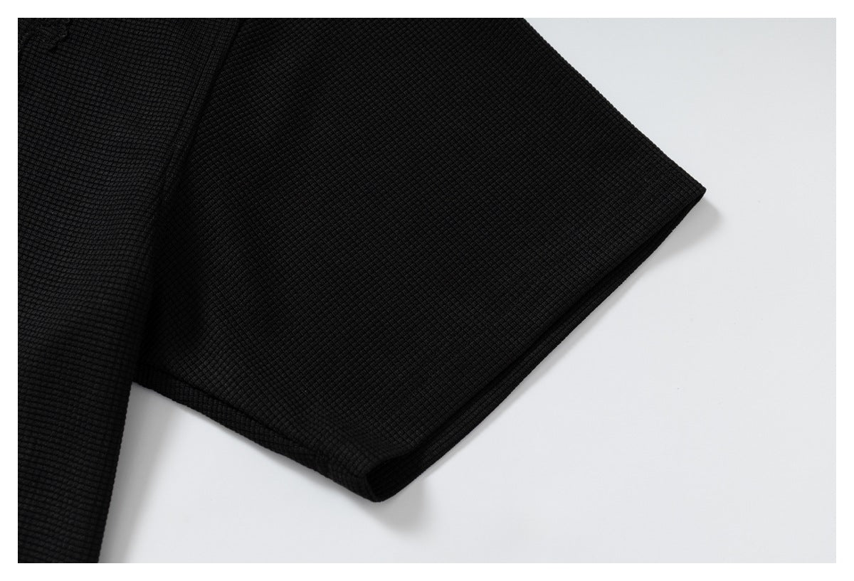 DAXUEN black polo shirt with leopard print collar and cross graphic
