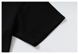 DAXUEN black polo shirt with leopard print collar and cross graphic