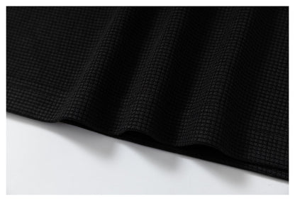 DAXUEN black polo shirt with leopard print collar and cross graphic