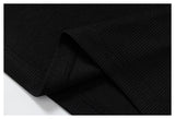 DAXUEN black polo shirt with leopard print collar and cross graphic
