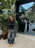 DAXUEN Wide-leg denim jeans with leopard print and stars — model photo