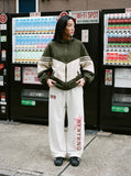 DAXUEN black wide-leg leopard print track pants — model photo