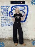 DAXUEN Leopard star graphic t-shirt with gothic text — model photo