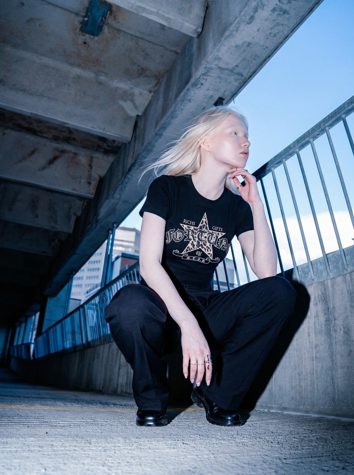 DAXUEN Leopard star graphic t-shirt with gothic text — model photo