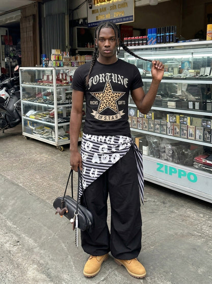 DAXUEN Leopard star graphic t-shirt with gothic text — model photo