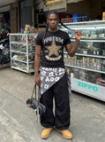 DAXUEN Leopard star graphic t-shirt with gothic text — model photo