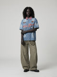 DAXUEN light blue denim shirt with pink collar and embroidered details — model photo
