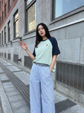 DAXUEN light blue oversized grid casual pants — model photo