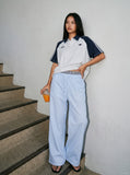 DAXUEN light blue oversized grid casual pants — model photo