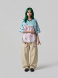 DAXUEN light blue oversized star-patterned jersey top — model photo