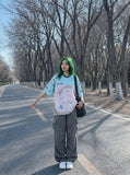 DAXUEN light blue oversized star-patterned jersey top — model photo