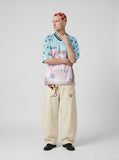 DAXUEN light blue oversized star-patterned jersey top — model photo