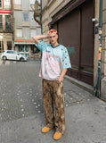 DAXUEN light blue oversized star-patterned jersey top — model photo