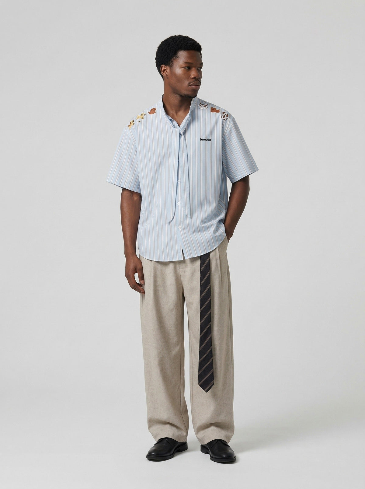 DAXUEN Light blue short-sleeved striped shirt with puppy embroidery — model photo